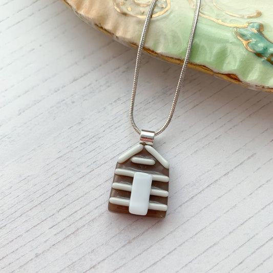 This nude beach hut necklace is inspired by the nature from my local Pembrokeshire countryside. Handmade in Wales. Comes with a chain.