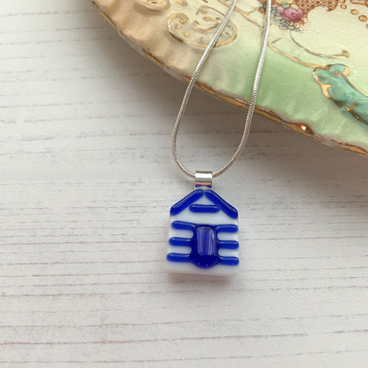 This blue beach hut necklace is inspired by the nature from my local Pembrokeshire countryside. Handmade in Wales. Comes with a chain.