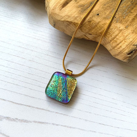 This twinkle brown necklace is a handmade necklace that I make with my favourite type of glass, dichroic.