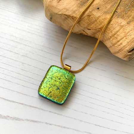 This twinkle gold necklace is a handmade necklace that I make with my favourite type of glass, dichroic.