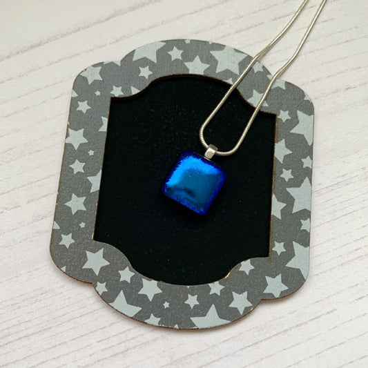 This ingenue bright blue necklace is a handmade necklace that I make with my favourite type of glass, dichroic.
