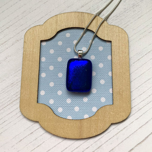 This ingenue cobalt blue necklace is in multicoloured dichroic glass. It is a handmade necklace inspired by the princess in all of us!