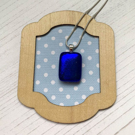 This ingenue cobalt blue necklace is in multicoloured dichroic glass. It is a handmade necklace inspired by the princess in all of us!