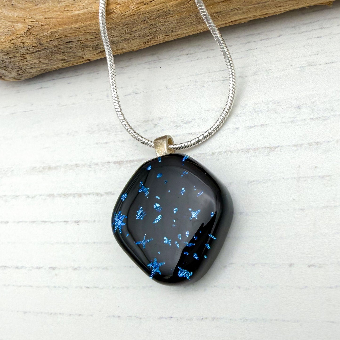 Black abstract star dichroic necklace