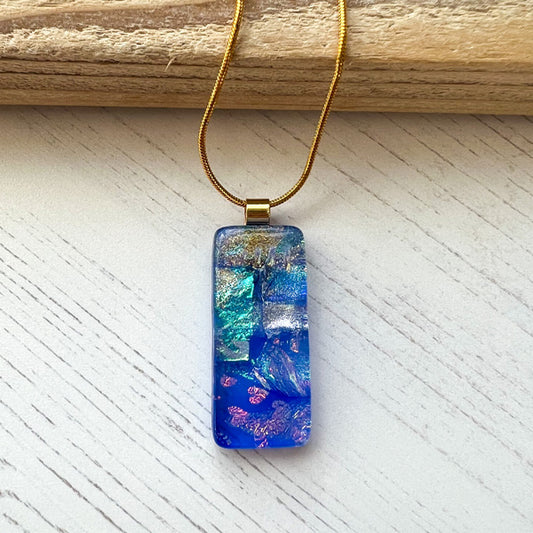 This twinkle green glass necklace is a handmade necklace that I make with my favourite type of glass, dichroic.