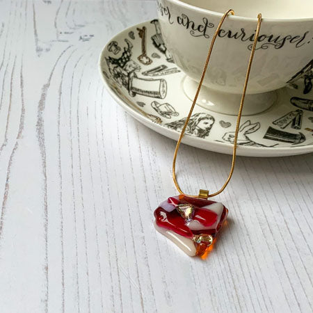 This pink orange signature glass necklace is a handmade necklace that is inspired by my favourite style of creating necklaces.