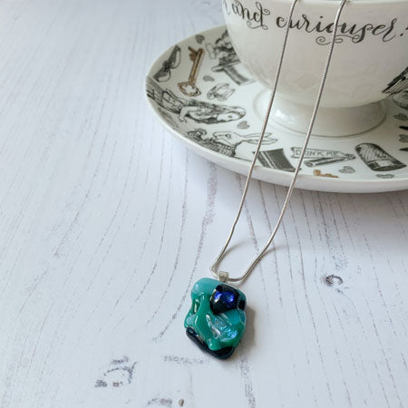 This green coloured petite signature glass necklace is a handmade necklace that is inspired by my favourite style of creating necklaces.