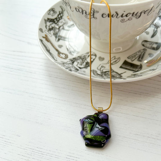 This purple green glass necklace is a handmade necklace that is inspired by my favourite style of creating necklaces.