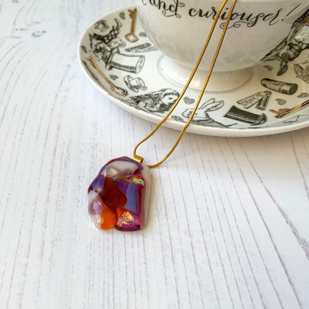 This purple orange glass necklace is a handmade necklace that is inspired by my favourite style of creating necklaces.