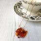 This orange signature dichroic glass necklace is a handmade necklace that is inspired by my favourite style of creating necklaces.