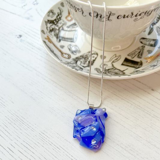 This purple blue signature dichroic glass necklace is a handmade necklace that is inspired by my favourite style of creating necklaces.