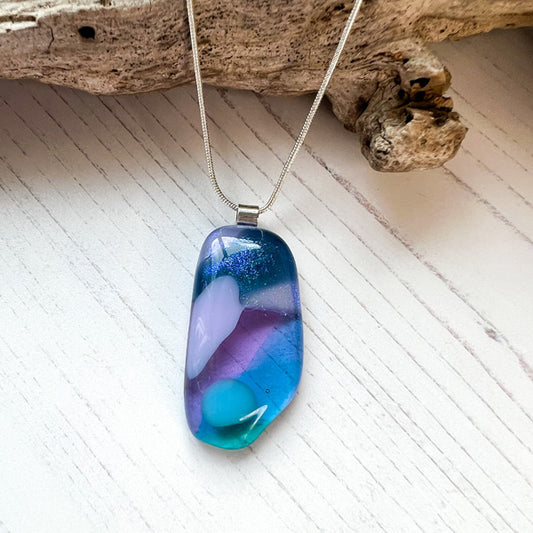 This sea dichroic glass necklace ten is a handmade necklace inspired by my local beaches, I love how the sea changes colours during the different seasons. I explore the beaches in the winter hoping to find sea tumbled glass, driftwood and any other treasures!