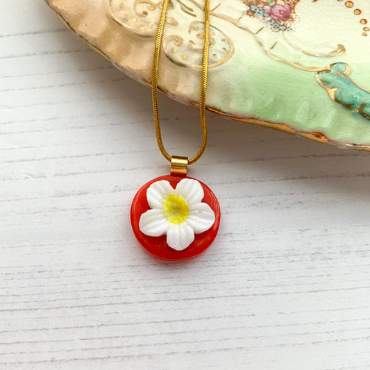 This orange white flower necklace is inspired by the nature from my local Pembrokeshire countryside. Handmade in Wales. Comes with a chain.