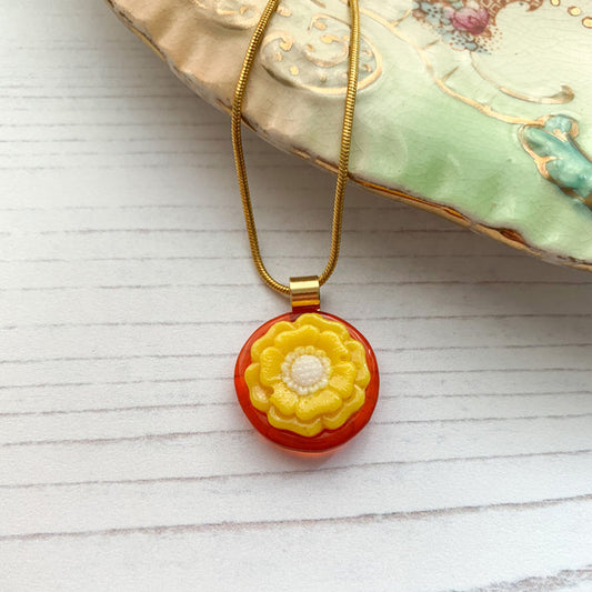 This orange yellow flower necklace is inspired by the nature from my local Pembrokeshire countryside. Handmade in Wales. Comes with a chain.
