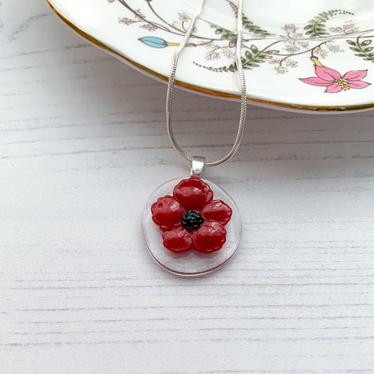 This red flower necklace is inspired by the nature from my local Pembrokeshire countryside. Handmade in Wales. Comes with a chain.