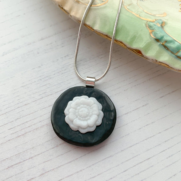 This grey white flower necklace is inspired by the nature from my local Pembrokeshire countryside. Handmade in Wales. Comes with a chain.