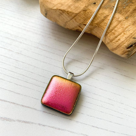 This square twinkle pink necklace is a handmade necklace that I make with my favourite type of glass, dichroic.