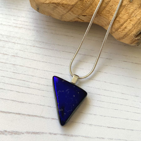 This triangle twinkle blue necklace is a handmade necklace that I make with my favourite type of glass, dichroic.
