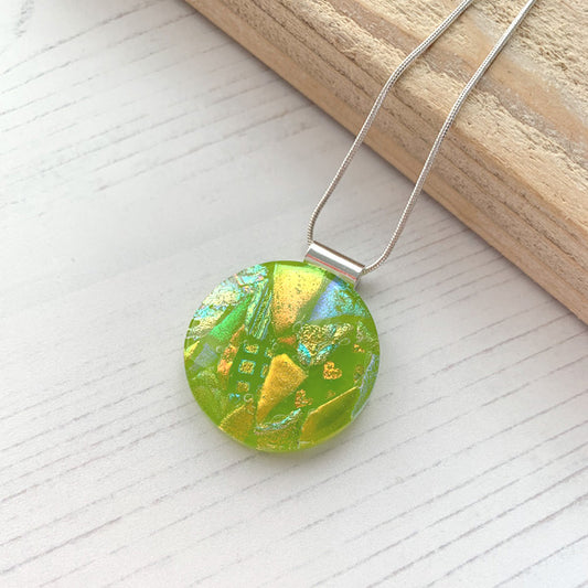 This twinkle green circle glass necklace is a handmade necklace that I make with my favourite type of glass, dichroic.