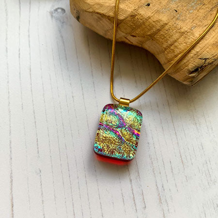 This twinkle red gold necklace is a handmade necklace that I make with my favourite type of glass, dichroic.