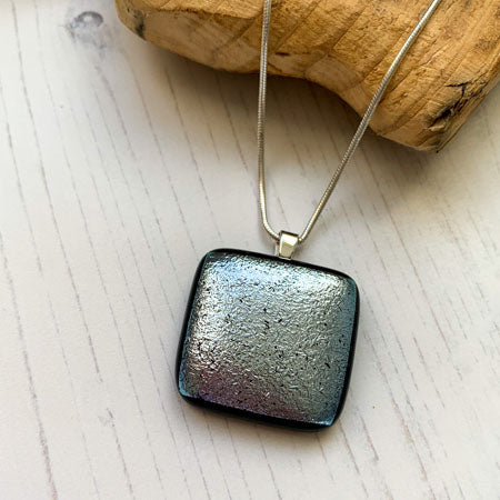 This twinkle silver necklace is a handmade necklace that I make with my favourite type of glass, dichroic.