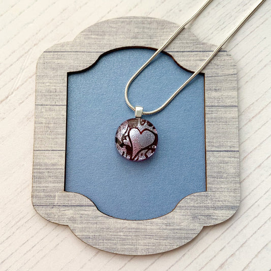 This ingenue pink heart necklace is in pink and silver dichroic glass. It is a handmade necklace inspired by the princess in all of us!