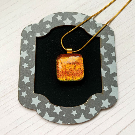 This ingenue copper orange necklace is a handmade necklace that I make with my favourite type of glass, dichroic.