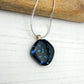 Black abstract star dichroic necklace